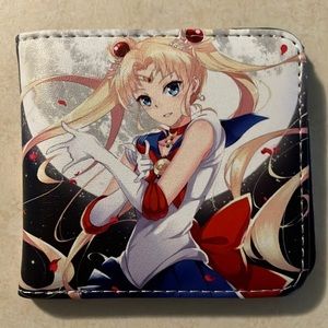Sailor Moon art wallet, never used, roughly 9” when open